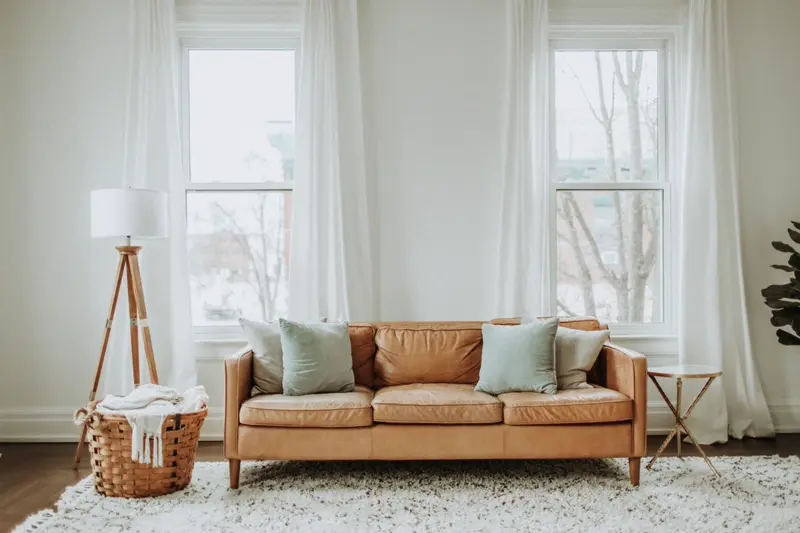 Tan leather sofa in a bright living room